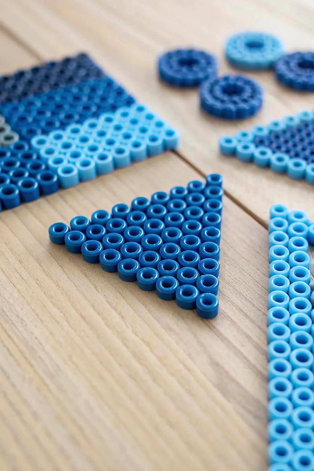 Elevate your space with the simplicity and elegance of blue geometric perler bead art.